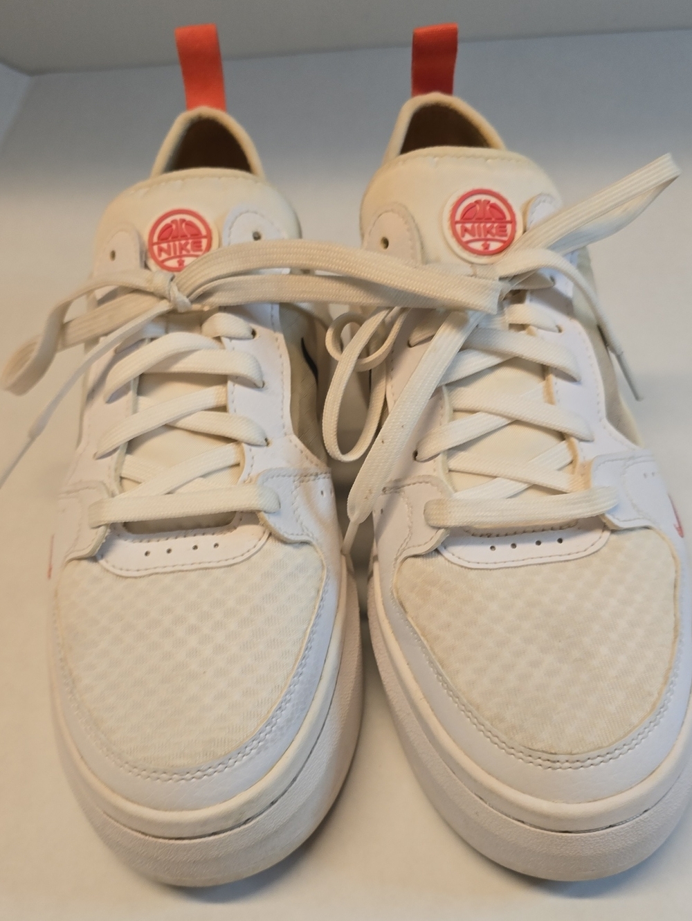 Nike Women’s Low-Top Sneakers in Off-White with Coral Pull Tabs